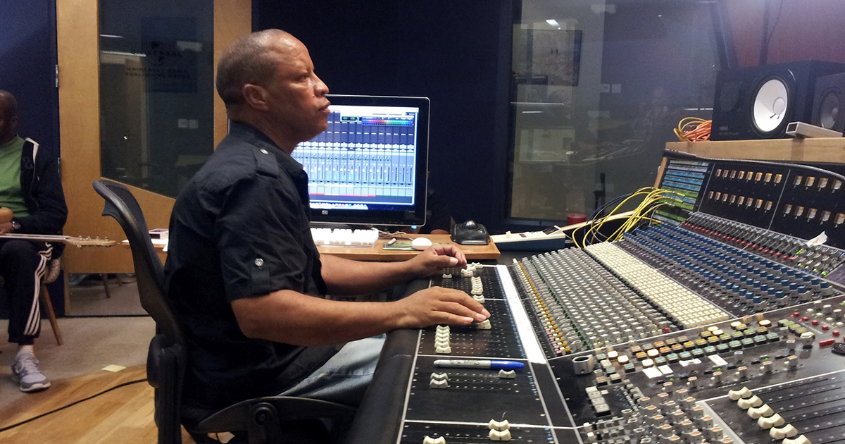 Picture of Ralph Sutton Recording Engineering working on a vintage API recording and mixing console at Sony Music.