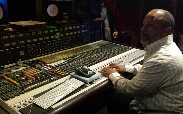 Ralph Sutton riding the faders during a mixing session